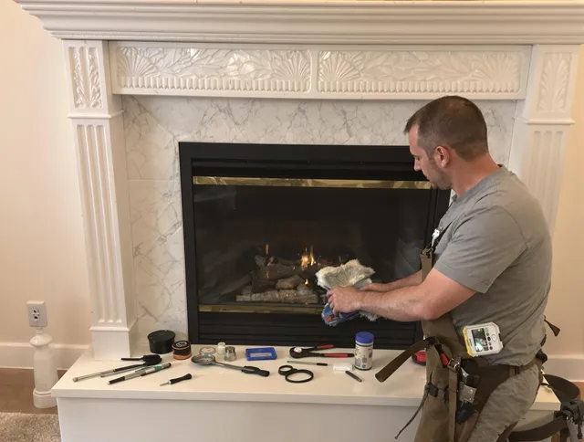 Danbury Chimney Sweep performing fireplace maintenance in Danbury, CT