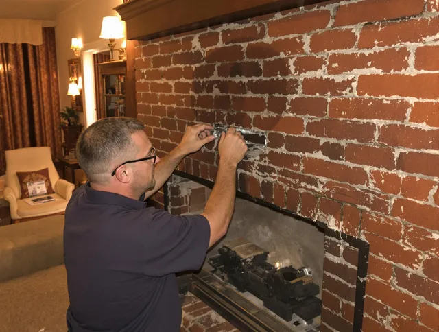 Danbury Chimney Sweep expert fixing a fireplace in Danbury, CT